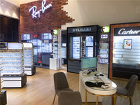 Magasin de vente de lunettes au détail sur mesure Meuble de rangement pour lunettes de décoration design d'intérieur Étagère de présentation optique en métal doré