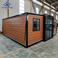 Villa Modulaire Préfabriquée de Luxe 20/40 pieds en Bois Grainé avec Double Aile Extensible et Porte Vitrée pour Complexes Hôteliers