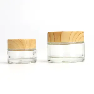 Wholesale Cosmetic 1 unzen 2 unzen klar gefrostet glas glas bambus holzmaserung kunststoff deckel mit kunststoff innen