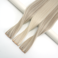Lanxun Vente en gros de tissages de cheveux humains russes bruts doublement étirés, trame papillon avec trou central XO