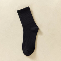 Chaussettes unisexes de haute qualité à prix de gros, logo personnalisé, couleur unie, chaussettes noires et blanches pour un usage quotidien