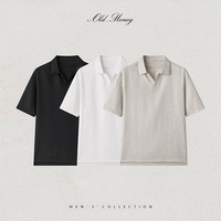 Polo homme Old.Money à manches courtes, noir uni, coupe classique, style minimaliste, tissu Oxford tissé