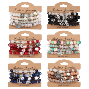 Bracelets à breloques tendance pour femmes, imitation perle, cristal, strass, breloques papillon, ancre, éléphant, bijoux cadeau fabriqués en Chine - Product Image 1