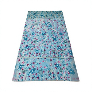 Elegante Vestido Africano Azul con Bordado Floral y Detalles de Pedrería - Product Image 1