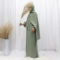 2024 Vente en Gros Nouveau Style Abaya Élégante Dubaï Modeste Jilbab pour Femmes Musulmanes Robe Longue Couleur Unie Tendance avec Hijab
