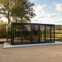 Maison conteneur pliable extensible en verre noir pour le glamping et l'hébergement temporaire