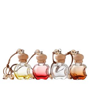 Diffuseur de parfum pour voiture en forme de pomme noire de 10 ml, flacon en verre décoratif suspendu avec bouchon en bois - Product Image 2