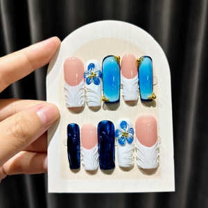 Uñas Postizas para Crear una <span class=keywords><strong>Manicura</strong></span> <span class=keywords><strong>Francesa</strong></span> Blanca y Azul <span class=keywords><strong>con</strong></span> Flores 3D, Adornos de Estrellas de Mar Doradas y Perlas, y Formas de Almendra - Product Image 2
