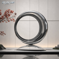 Grande sculpture circulaire en acier inoxydable poli miroir, art métallique moderne en boucles concentriques, pour cour de villa, fabrication sur mesure