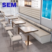 Ensemble de mobilier moderne pour café, cantine et restaurant SEM : banquette en cuir, canapé et tables à plateau en pierre frittée