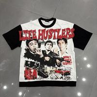 Kaos Raglan Pria Life Hustlers Model Distressed dengan Grafis Cutout, Warna Hitam Putih Kontras, Lengan Pendek, Streetwear