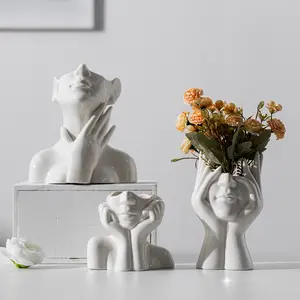 Spot Nuevo producto Jarrón de cerámica de arte corporal blanco Dispositivo de flores creativas Florero de sala de estar para arreglo floral