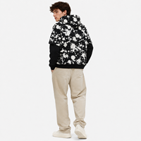 Sweat à capuche personnalisé superposé, imprimé effet éclaboussures, coupe oversize, épais, noir et blanc, épaules tombantes, poche kangourou, style streetwear, vente en gros