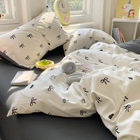 Ensemble de literie en coton lavé avec nœud noir et cœur - Ensemble de literie doux et confortable en 4 pièces pour la chambre des filles