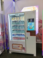 Distributeur automatique de boissons et de snacks réfrigéré en acier inoxydable à grande capacité avec écran tactile et gestion basée sur le cloud pour usage commercial
