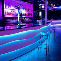 Comptoirs de bar éclairés en surface solide de style occidental avec LED, design moderne, mobilier de bar