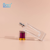 Bouteille de parfum en verre transparent carré vide de luxe de 75 ml avec bouchon en cristal fuchsia et pulvérisateur pour parfum de femme