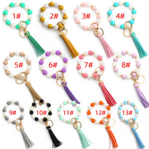 Venta al por mayor <span class=keywords><strong>de</strong></span> las mujeres <span class=keywords><strong>de</strong></span> moda borla colgante Anti-Lost silicona PVC cuentas pulsera brazalete llavero Anti-Lost <span class=keywords><strong>encanto</strong></span> regalos - Product Image 1