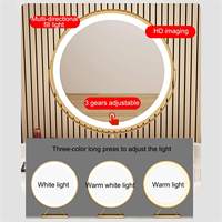 Coiffeuse moderne de luxe en bois avec armoire latérale ronde et bordure en cuir, miroir LED 360° et pieds en fer plaqué or pour chambre à coucher