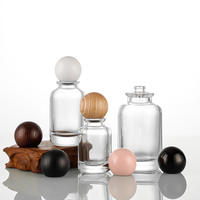 30ML 50ML 100ML Botellas de perfume de vidrio redondas multiespecificación con 15 tapas de bayoneta empaquetadas en tapas de bola de madera de colores