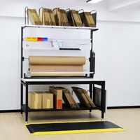 Table d'emballage robuste en acier, hauteur réglable, plan de travail avec convoyeur à rouleaux, capacité de 500 kg, certifiée ISO 9001
