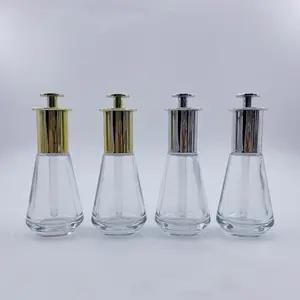 Hotsale New Design 45ml Drop Glass Essential Oil Bottle With Gold Aluminium Pressing Head Droppers