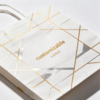 Sac fourre-tout élégant en kraft blanc épais avec estampage à chaud personnalisé pour magasin de vêtements, sacs cadeaux pour marques de créations artisanales