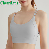 Soutien-gorge de sport haute performance résistant aux chocs pour femme, avec rembourrage fixe, fines bretelles croisées au dos, idéal pour l'entraînement, le fitness et le yoga