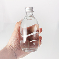 Bouteille de Kombucha en verre transparent ambré de 300ml 500ml avec couvercle auto-scellant pour café thé infusé à froid