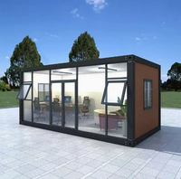 Maison conteneur préfabriquée modulaire en acier de 20 pieds avec mur rideau en verre pour bureau, studio, jardin, extérieur