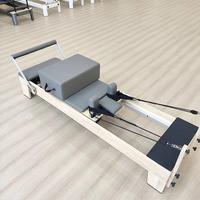 Reformer Pilates en chêne de qualité studio, pliable et réglable, équipement de fitness pour les jambes, vente en gros OEM