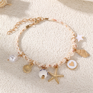 Pulsera Tejida Multicolor Hecha a Mano con Dijes de Oro de la Serie Océano: Estrella de Mar, Tortuga, Pez, Flor y Perla - Product Image 4