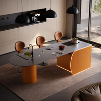 Îlot de cuisine moderne et minimaliste en acier inoxydable avec table à manger intégrée pour cuisines ouvertes et salons – Design ovale fixe