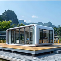 Maison conteneur moderne modulaire en acier Villa capsule spatiale portable Apple Pod Cabine inspirée entrepôt commercial extérieur