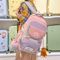 Sac à dos d'écolier en gros avec design contrasté et pendentif pour collégiens