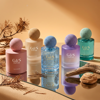 Flacon de parfum cylindrique vide personnalisé en gros 50ml 100ml, pulvérisateur de luxe en verre pour emballage de parfum de marque de beauté