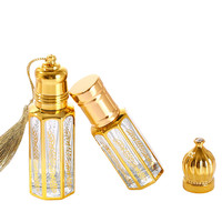 Vente en gros de bouteilles octogonales en or de luxe Attar Boîte de 6ml 10ml 12ml Bâton de verre Huile de parfum Bouteille d'huile essentielle arabe sérigraphiée
