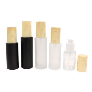Eco Friendly Cosmetic Frosted <b>Glass</b> Cream Jar Shampoo Lotion Pump Bottle Bamboo Wood Lid Skin Care Liquid Set Packaging - Product Image 1