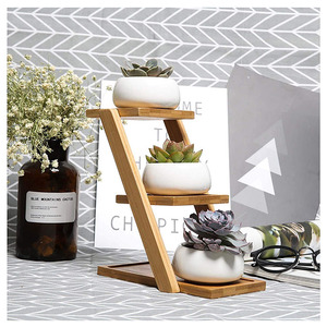 Petit support <span class=keywords><strong>de</strong></span> plante mobile personnalisable présentoir <span class=keywords><strong>de</strong></span> fleurs d'intérieur en bois <span class=keywords><strong>de</strong></span> bambou multicouche pour centre commercial fini en <span class=keywords><strong>peinture</strong></span> - Product Image 4