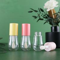 Vente en gros 15ml en forme d'ampoule avec logo personnalisé rose clair jaune mignon brillant à lèvres vide fantaisie tubes avec bouchon à vis de forme ronde