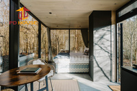 Studio en verre luxueux et miroité pour location de vacances en montagne et éco-tourisme