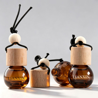 Vente en gros de flacons diffuseurs de parfum pour voiture en verre vide de 10 ml, de couleur vert mat, en forme d'orange, avec bouchon en bois