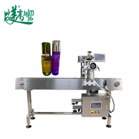 Machine de marquage laser UV à positionnement rotatif pour ligne de production en ligne, avec capteur de code couleur et gravure de code de traçabilité GS1