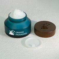 Pot en verre crème mat vert sarcelle à épaule oblique avec couvercle en bois massif pour emballage de soins de la peau en marque blanche OEM