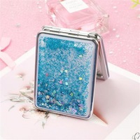 Kustom Logo pribadi Mini lipat bulat kecil tangan cermin dua sisi pasir hisap cair Glitter saku kompak cermin untuk Makeup