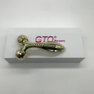 Rodillo de masaje 3D de metal Color dorado con mango largo - Product Image 4