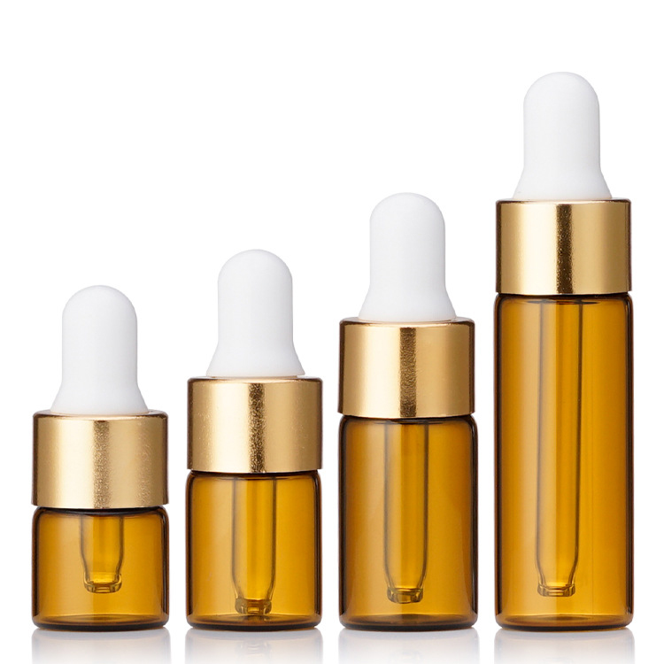 Ámbar + Tapa cuentagotas dorada + Tetina blanca