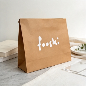 Pochette en papier kraft jaune avec logo blanc imprimé sur mesure, recyclable, pour vêtements, emballage cadeau - Product Image 1