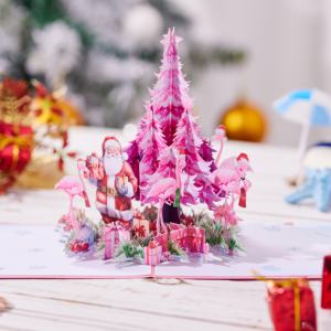 Tarjeta de Felicitación 3D Pop-up con Tema de Papá Noel y Flamencos, con un Lujoso y Fantástico Árbol de Navidad Rosa y una Pila de Regalos Rosados - Product Image 1