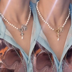 Nouveauté été : Collier de luxe abordable pour femme, style Western, en tungstène plaqué or, avec pendentif Orb Planète, nœud, goutte d'eau et perle - Product Image 2